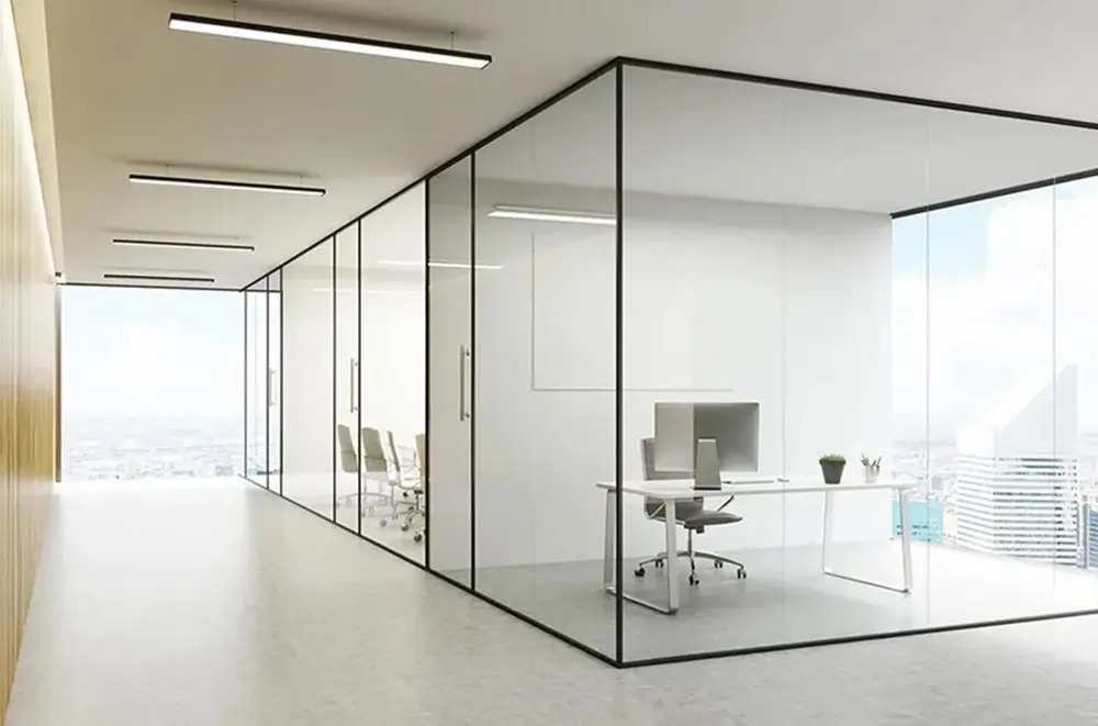 Frameless toughened glass office partition cabins installed in a Bengaluru office